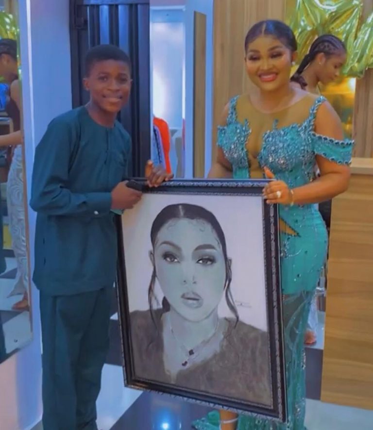 Daniel with a portrait of E-Money